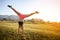 Woman Standing upside down on the evening workout