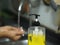 a woman standing and washing her hands at the sink to prevent germs protect colona virus, covid 19 DIGITAL CAMERA