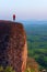 Woman standing watching on the three whale rock mountain at Bueng Kan Province,Thailand