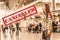 A woman stands in airport, waiting for the plane to take off. Blurred. Close up.Cancelled sign.The concept of a ban on