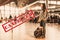 A woman stands with a backpack in airport, waiting for the plane to take off. Blurred. Cancelled sign.The concept of a ban on