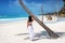 Woman stands at the Caribbean beach of Tulum, Riviera Maya, Mexico