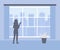 Woman stands at home and looks out of window at city. Female silhouette in interior of house. Lonely, boredom