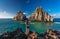 Woman stands near Two brother Rock ,Fernando de Noronha