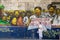 Woman stands at the street with political poster `Hands off Diego Garcia` painted at the wall in Ville Noire, Mauritius island.