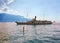 Woman standup paddle board and excursion ship Vevey Swiss Riviera