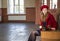 Woman at station sit on worn bench