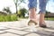 Woman stepping in chewing gum on sidewalk