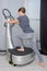 Woman stepping onto fitness machine