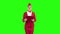 Woman steps with a red folder in her hands . Green screen. Slow motion