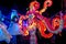 Woman on stilts with spectacular pink octopus costume