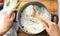 Woman stirring boiled rice in saucepan, closeup