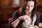 Woman stirring a cup of cappuccino