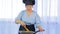 Woman stirring vegetables fried in a pan with chicken