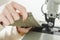 Woman stitching leather using a sewing machine