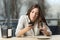 Woman stood up in a coffee shop