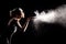 Woman With Stop Motion of Explosive Powder Captured by Flash