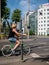 Woman at a stoplight riding a bicycle, People enjoying a nice day in the center of Bucharest after the coronavirus lockdown was