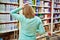 Woman in store with shopping cart