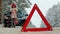 Woman with a straw car on the road in winter