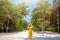 Woman in straw hat enjoy summer holidays in luxury palm beach resort