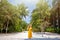 Woman in straw hat enjoy summer holidays in luxury palm beach resort