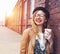 Woman in the street drinking coffee