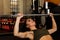 woman strengthens at the gym exercising with dumbbells