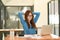 Woman stretches her arms when tired in the office, business woman relaxes, office syndrome