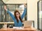 Woman stretches her arms when tired in the office, business woman relaxes, office syndrome