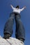 Woman stretching hands up - view from below