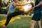 Woman stretching with help of personal trainer