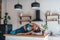 Woman stretching at home sitting on kitchen table.