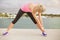 Woman stretching before morning exercise