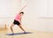 Woman stretching on yoga mat