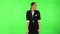 Woman strictly gesturing with hands crossed making X shape meaning denial saying NO. Green screen