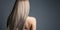 woman with a stright long healthy blond hair. rear view. banner with copy space