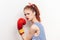 woman in striped jersey boxing gloves workout light background