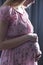 Woman stroking with love pregnancy belly