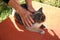 Woman stroking stray cat outdoors, closeup. Homeless animal