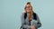 Woman, student and nerd in glasses with books, science and smile in portrait with learning on blue background. Excited