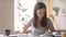 Woman student preparing for exam read textbook noting in notebook