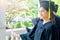 Woman student smiles and feel happy in  graduation gowns and cap