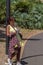 Woman studing plants in botanical garden in tropical part.