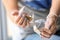 Woman with stylish beautiful manicure holding hourglass, closeup