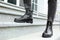 Woman in stylish boots on stairs outdoors, closeup