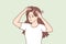 Woman suffering from hair loss touching head looking at scar through mirror. Vector image