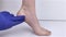 Woman suffering from heel pain. Inflammation or sprain of the tendon in the foot, heel spur, bursitis. The concept of diseases and