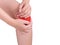 Woman suffering from knee pain, joint pains. red color highlight at knee