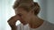 Woman suffering terrible migraine, massaging nasal bridge, health problems